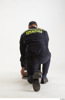 Sam Atkins Fireman Pose with Case kneeling whole body 0010.jpg
